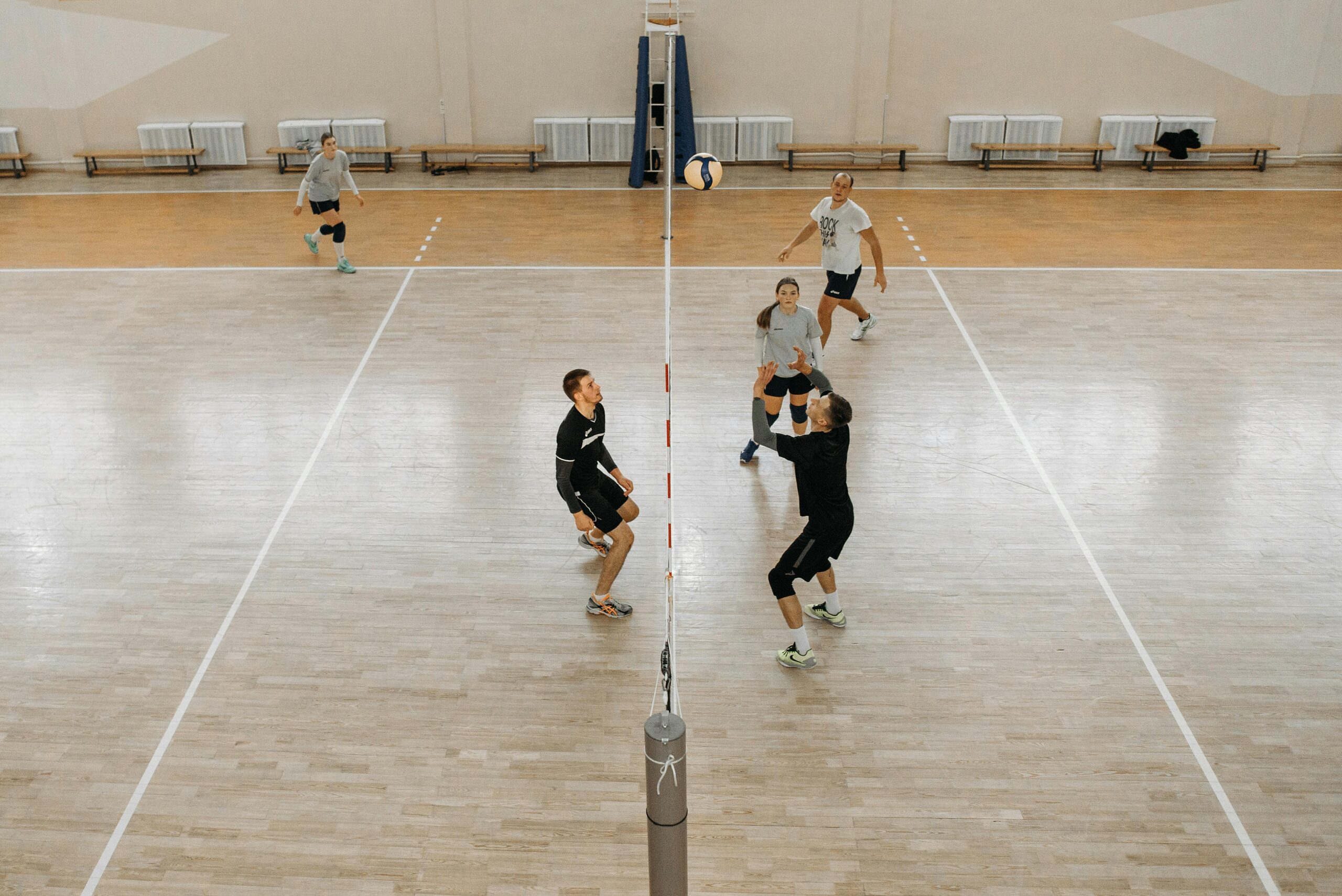 Photo by Pavel Danilyuk: https://www.pexels.com/photo/men-and-women-playing-volleyball-6203575/